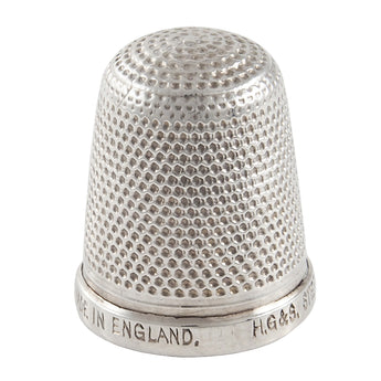 A mid-20th century, Sterling silver thimble.