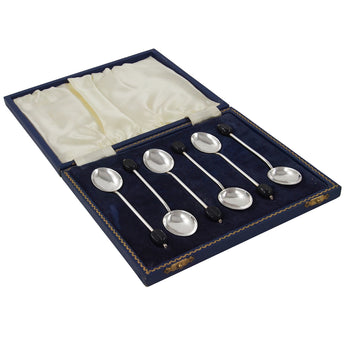 Six early 20th century, silver coffee spoons with coffee bean terminals & fitted case.
