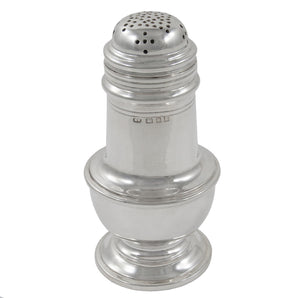 An early 20th century, silver pepperette on a pedestal foot.