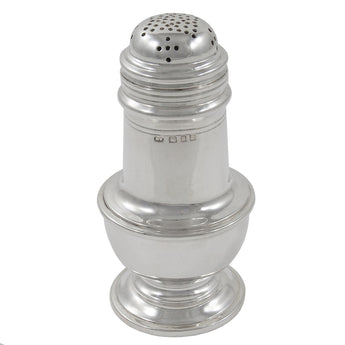 An early 20th century, silver pepperette on a pedestal foot.