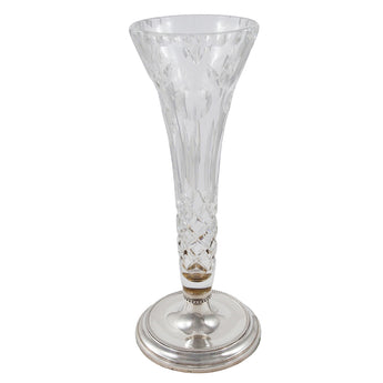 A modern, cut glass trumpet vase, on a circular silver base with beaded decoration.