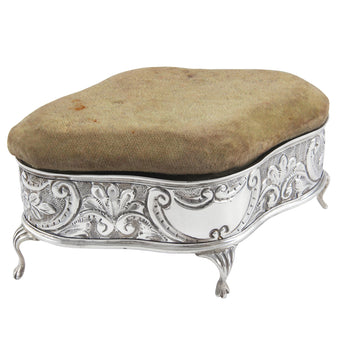 An Edwardian, silver trinket box with a cushion covered lid & fabric lined interior.