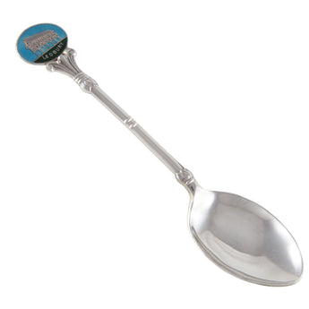 A mid-20th century, silver, enamel set souvenir teaspoon with the image of Ledbury Market Hall on the terminal end.