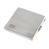 A modern, silver, square, engine turned powder compact