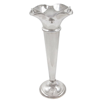 An Edwardian, silver trumpet vase with a shaped rim and a circular foot.
