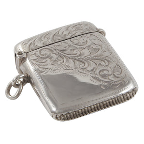 An Edwardian, silver, curved vesta case with floral engraving on the rear & three quarters of the front.