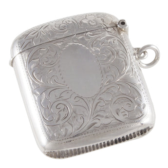 An Edwardian, silver vesta case with a vacant oval cartouche & floral decoration on the front & rear.