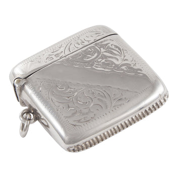 An Edwardian, silver, curved vesta case with a vacant ribbon cartouche & floral decoration front & back.