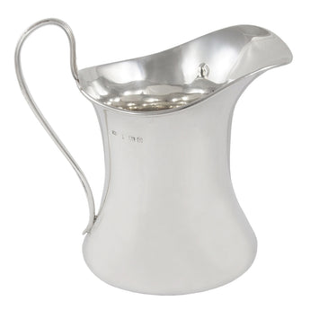 An early 20th century, silver cream jug