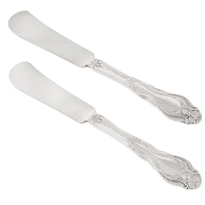 A pair of American butter spreaders