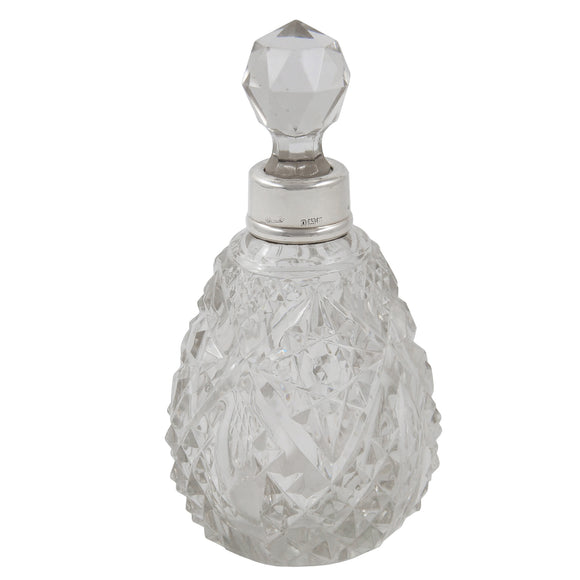 An Edwardian, glass scent bottle with a silver mount & glass stopper