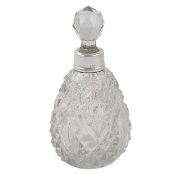 An Edwardian, glass scent bottle with a silver mount & glass stopper
