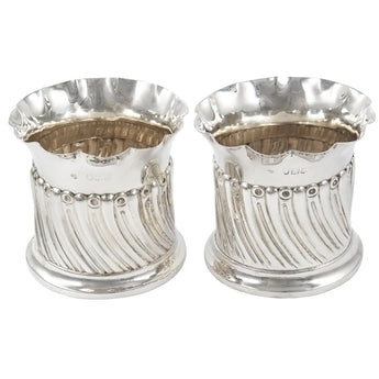 A pair of Victorian, silver, circular fern pots with spiral fluted decoration & scalloped rims.