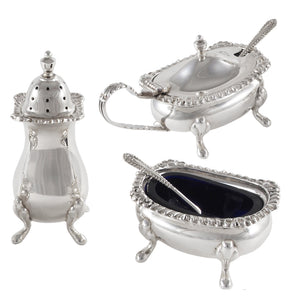 A mid-20th century, silver, three piece cruet, each piece is on four feet.