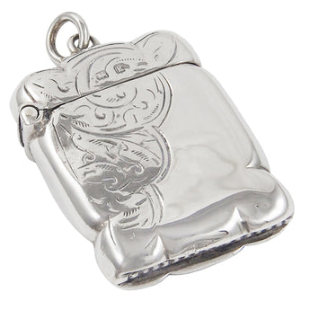 An Edwardian, silver vesta case with floral decoration covering half of the front & the rear sides.