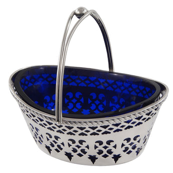 A Victorian, silver, oval, pierced sweet basket & blue glass liner.