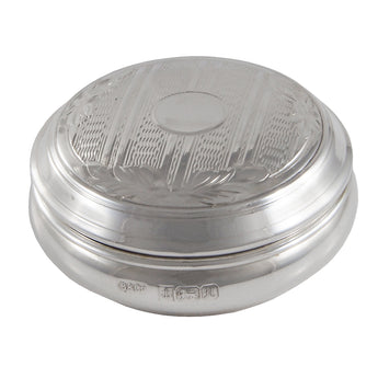A modern, silver, engine turned, lidded circular pill box