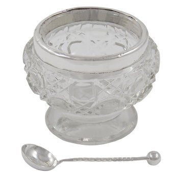 An Edwardian, cut glass open salt with a silver rim & spoon