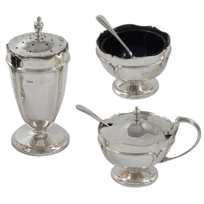 An early 20th century, silver, three piece cruet on pedestal feet.