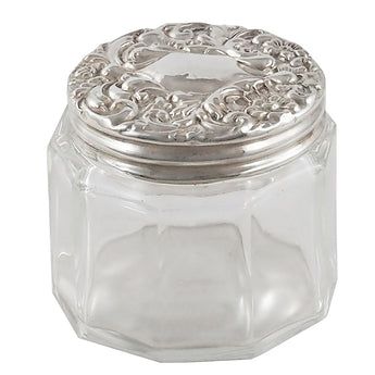An Edwardian, glass jar with a silver lid
