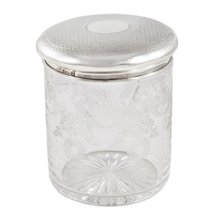 An early 20th century, etched glass jar with an engine turned silver lid & vacant cartouche.