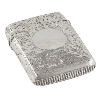 A Victorian, silver vesta case with a circular cartouche & floral design front & back