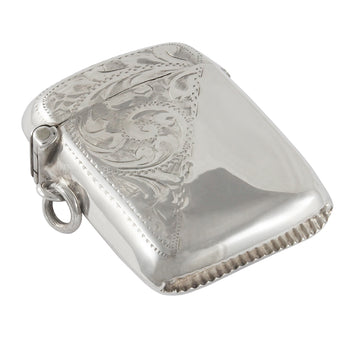 An Edwardian, silver vesta case with floral decoration covering half the front & back sides.