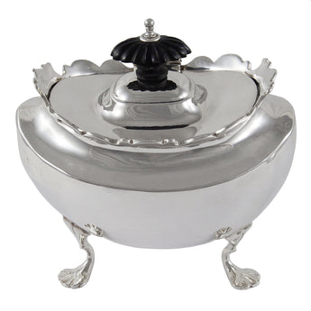 An Edwardian, silver tea caddy with a scalloped rim, ebonised finial & four feet.