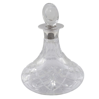 A modern, miniature, cut glass ships decanter with a glass stopper & a silver mount.