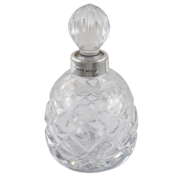A modern, glass scent bottle with a silver mount & glass stopper.