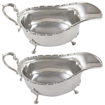 A pair of early 20th century, silver sauce boats.