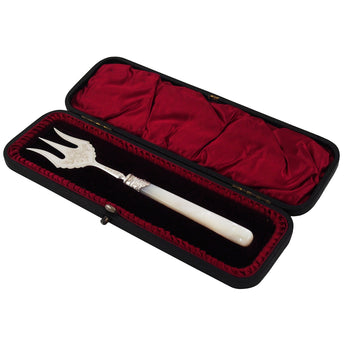 A Victorian, silver bread fork with a mother of pearl set handle & fitted case.