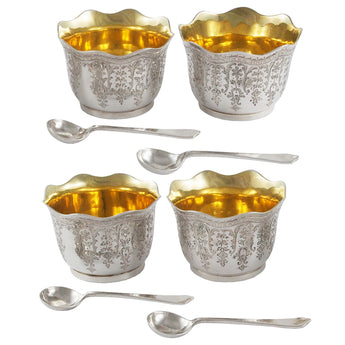 Four Victorian, silver open salts with gilt interiors & four spoons.