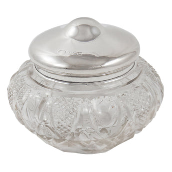 An Edwardian, large, cut glass jar with a silver lid.