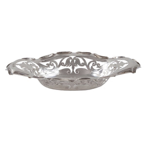 An Edwardian, silver, oval pierced bon bon dish with a scroll & foliate border.