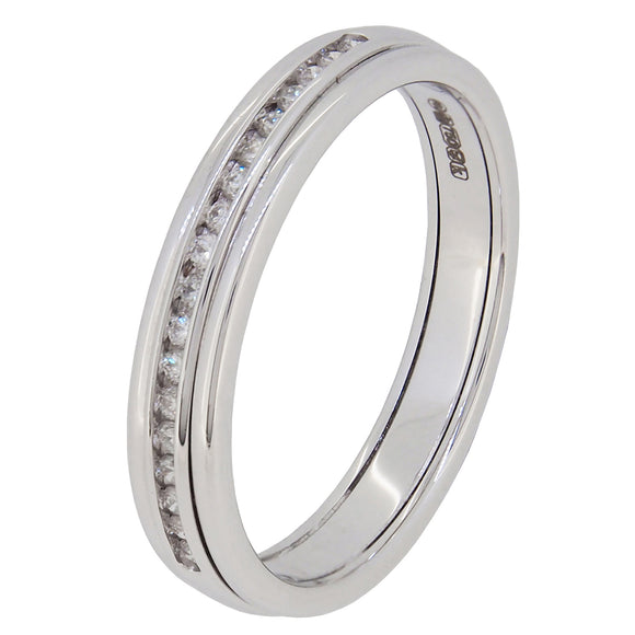 A modern, 18ct white gold, diamond set half eternity ring.