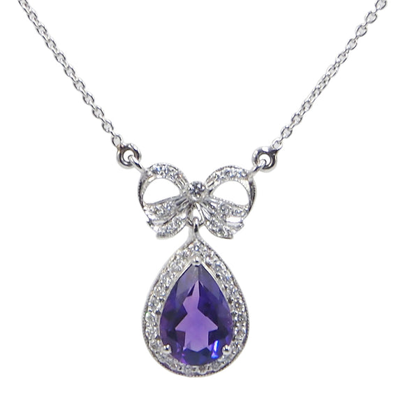  A modern, 18ct white gold, pear cut amethyst & diamond set bow necklace