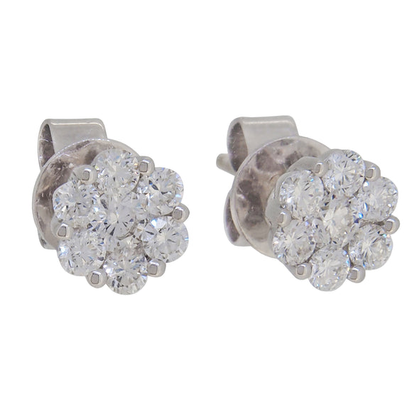 A pair of modern, 18ct white gold, diamond set cluster stud earrings.