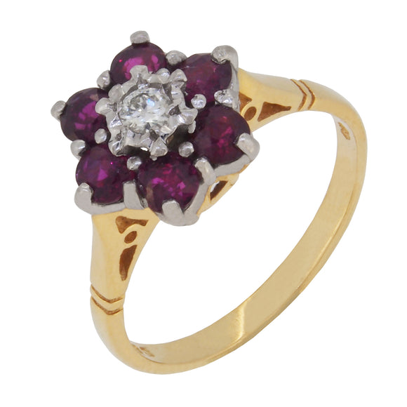 A modern, 18ct yellow gold, ruby & diamond set cluster ring.