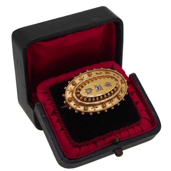 A Victorian, yellow gold, diamond set, shot & grain oval brooch & case