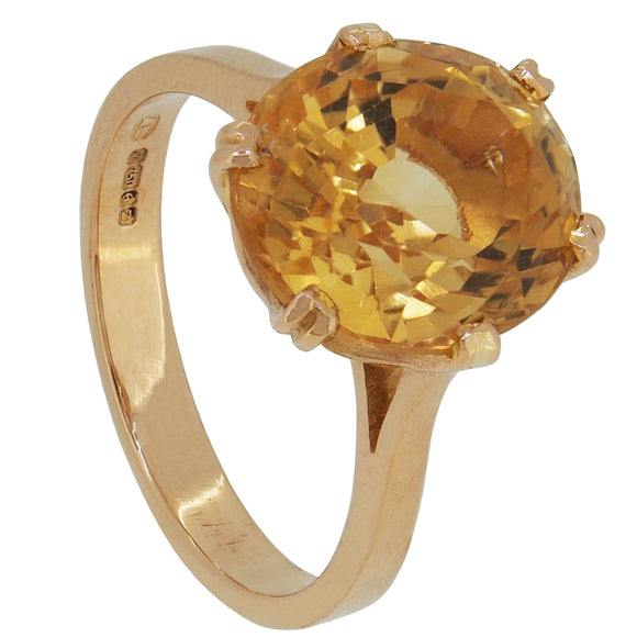 A modern, 18ct yellow gold, citrine set single stone ring.