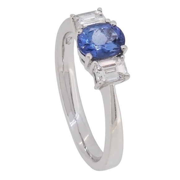 A modern, 18ct white gold, tanzanite & diamond set, three stone ring.