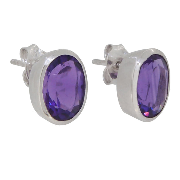 A pair of modern, 9ct white gold, amethyst set oval stud earrings