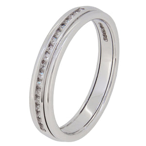 A modern, 18ct white gold, diamond set half eternity ring