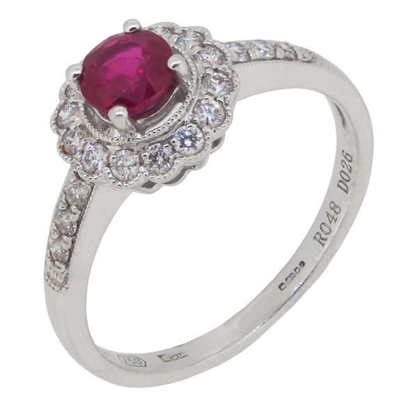 A modern, 18ct white gold, ruby & diamond set cluster ring with diamond set shoulders