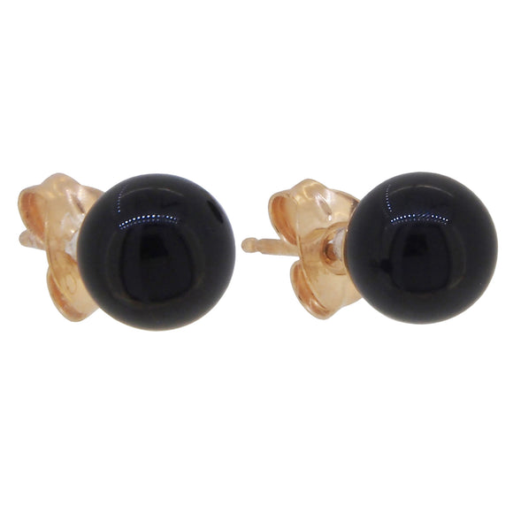 A pair of modern, yellow gold, black onyx set stud earrings