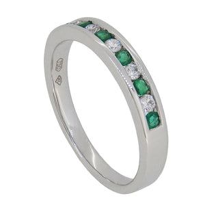 A modern, 18ct white gold, emerald & diamond set, eleven stone half eternity ring