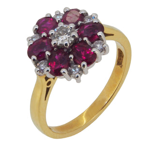 A modern, 18ct yellow gold, ruby & diamond set cluster ring