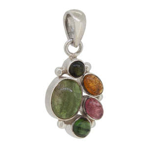 A modern, silver, tourmaline set pendant