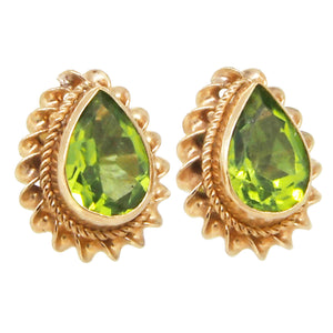 A pair of modern, 9ct yellow gold, peridot set, cord edged stud earrings.